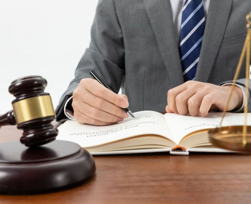 closeup-shot-person-writing-book